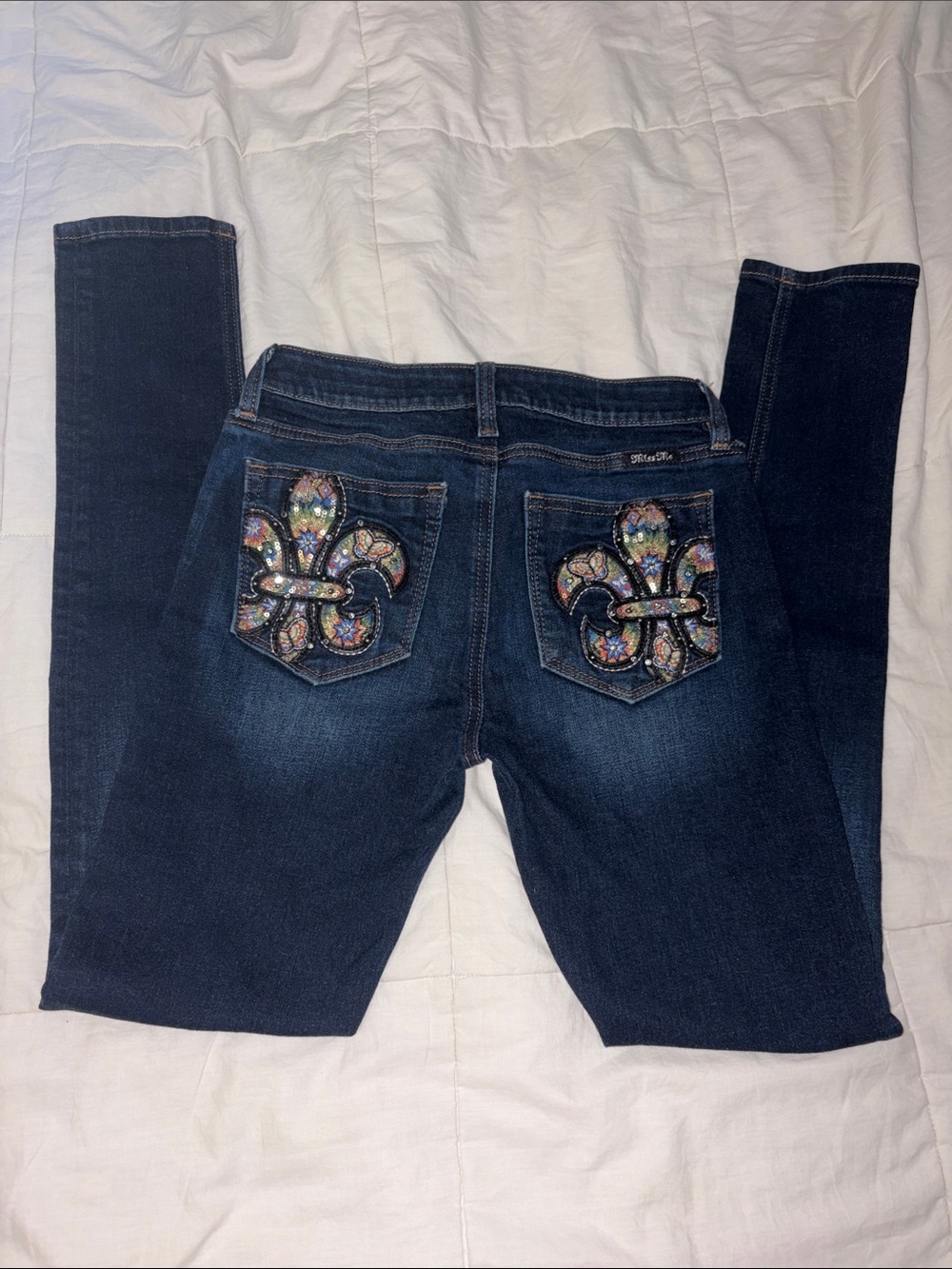 Miss Me Dark Wash Skinny Jeans with Embellished Rainbow Fleur de Lis Pockets